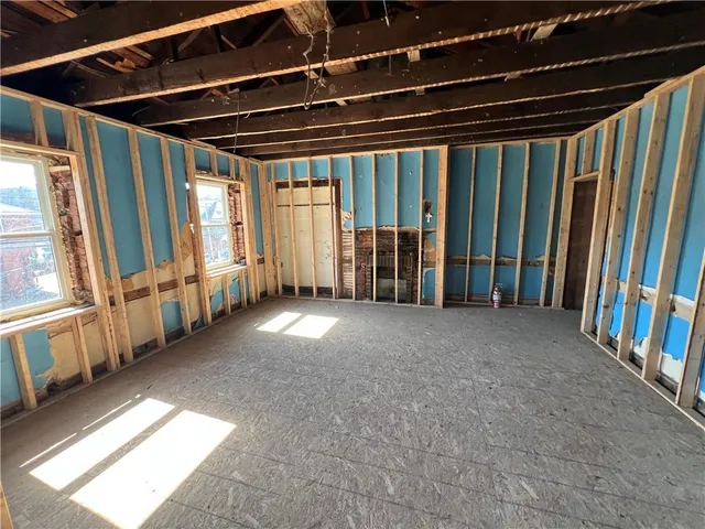a view of empty room with windows