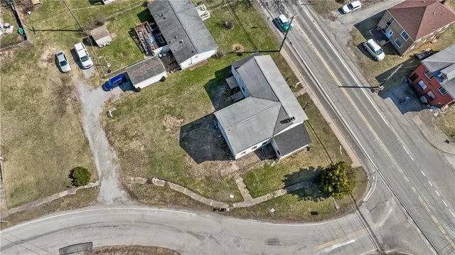 a view of a house with a mountain in the background
