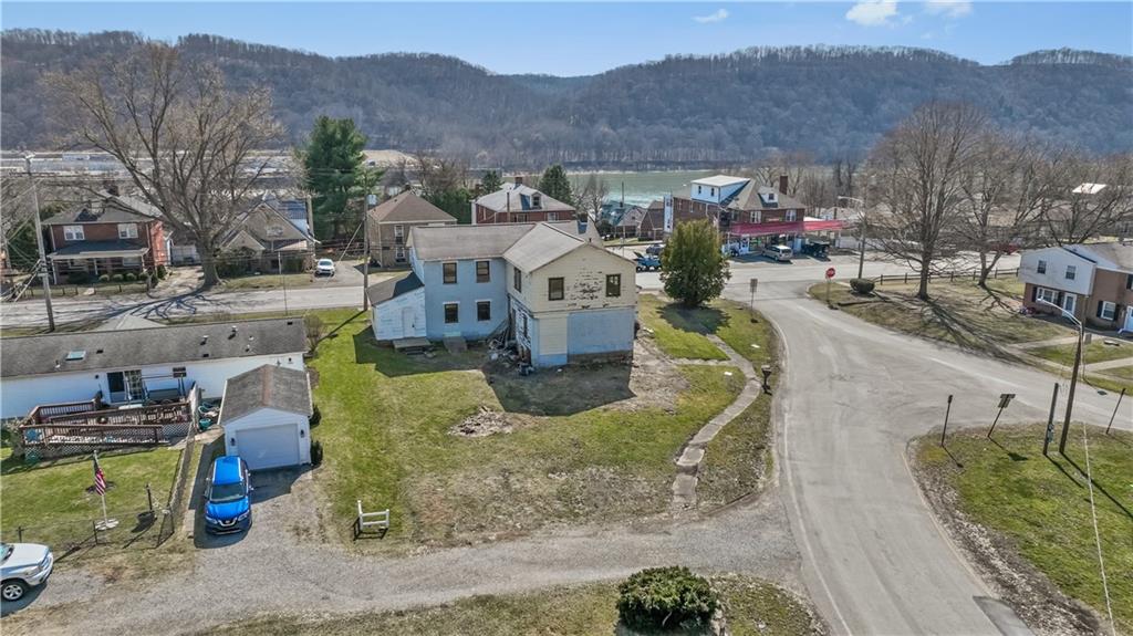 1250 Midland Beaver Road Industry, PA 15052 - Photo 34 of 40 a view of a house with a mountain in the background