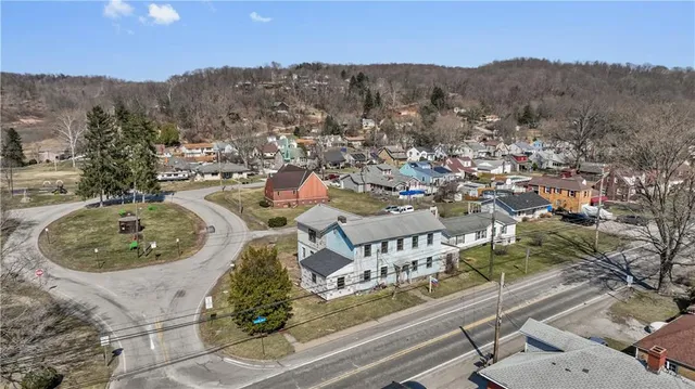 an aerial view of a house with mountain view