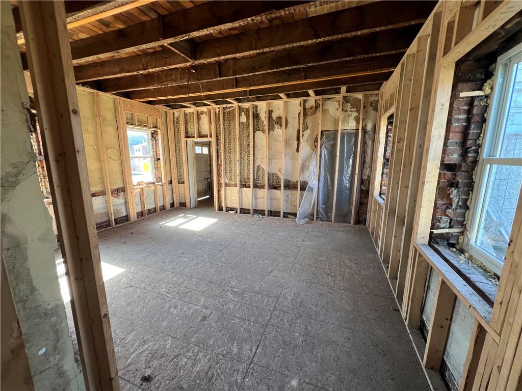 1250 Midland Beaver Road Industry, PA 15052 - Photo 6 of 40 a view of an empty room with wooden floor and stairs