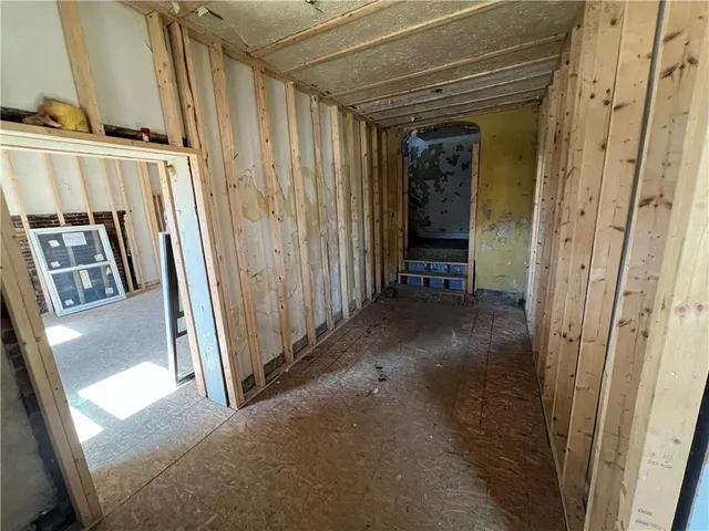 a view of a hallway with staircase