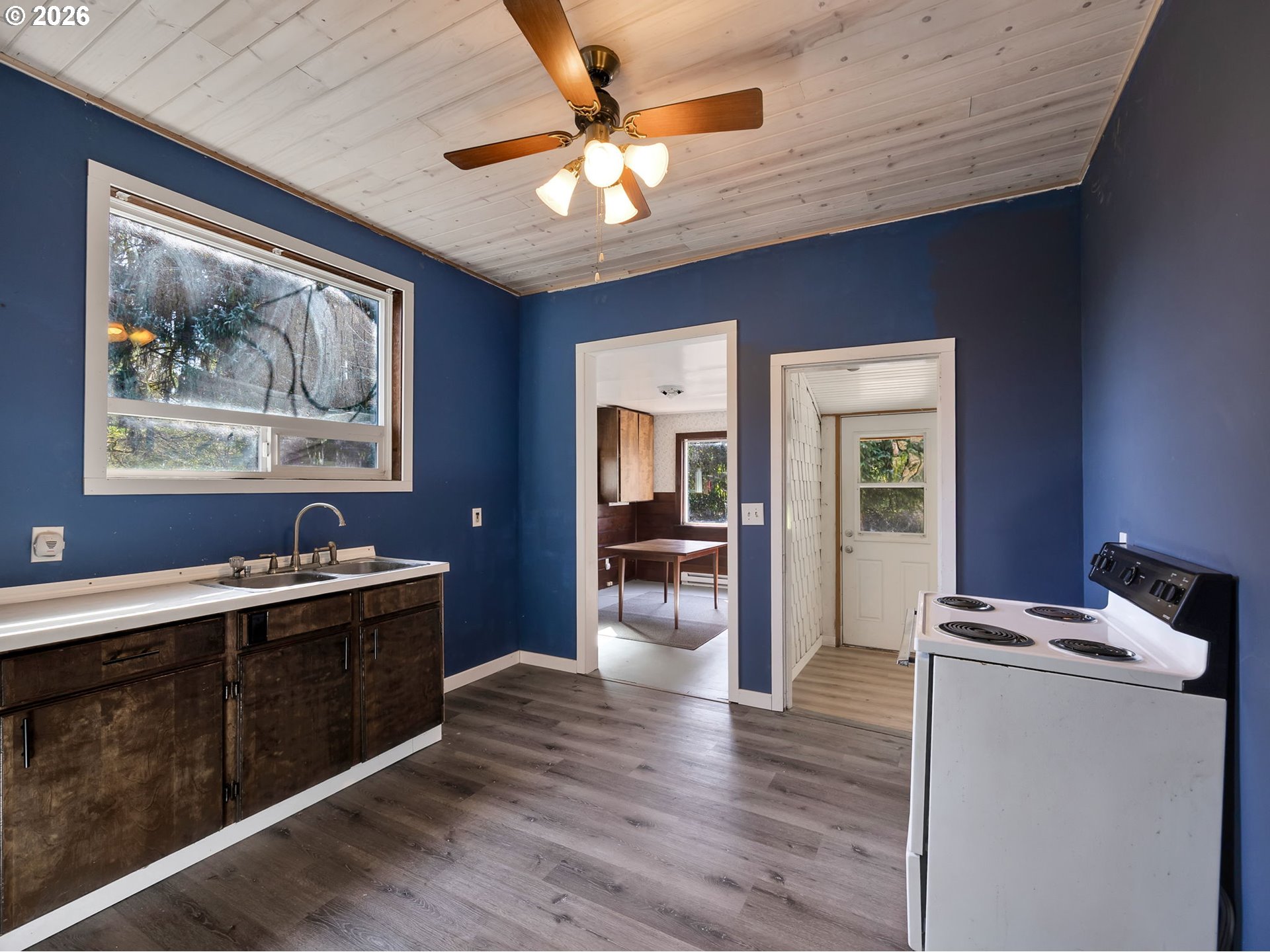 36290 7th Street Nehalem, OR 97131 - Photo 11 of 38 a view of a kitchen with a sink and wooden floor