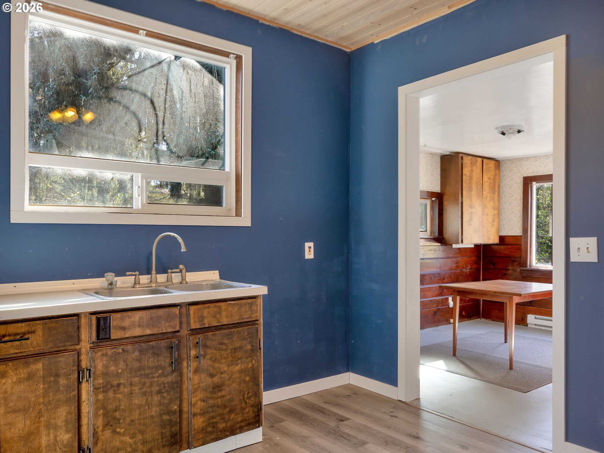 36290 7th Street Nehalem, OR 97131 - Photo 12 of 38 a room with a window a sink and a mirror