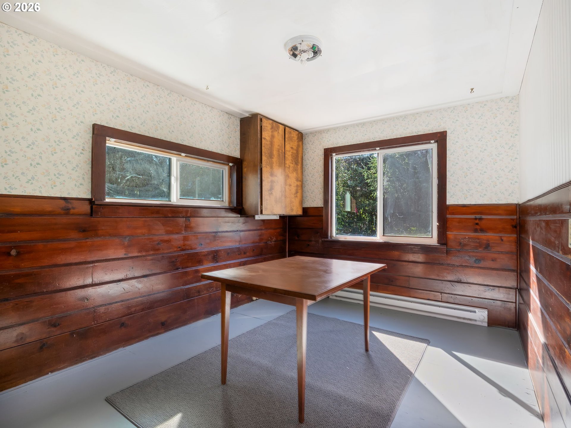 36290 7th Street Nehalem, OR 97131 - Photo 15 of 38 a room with a table and windows