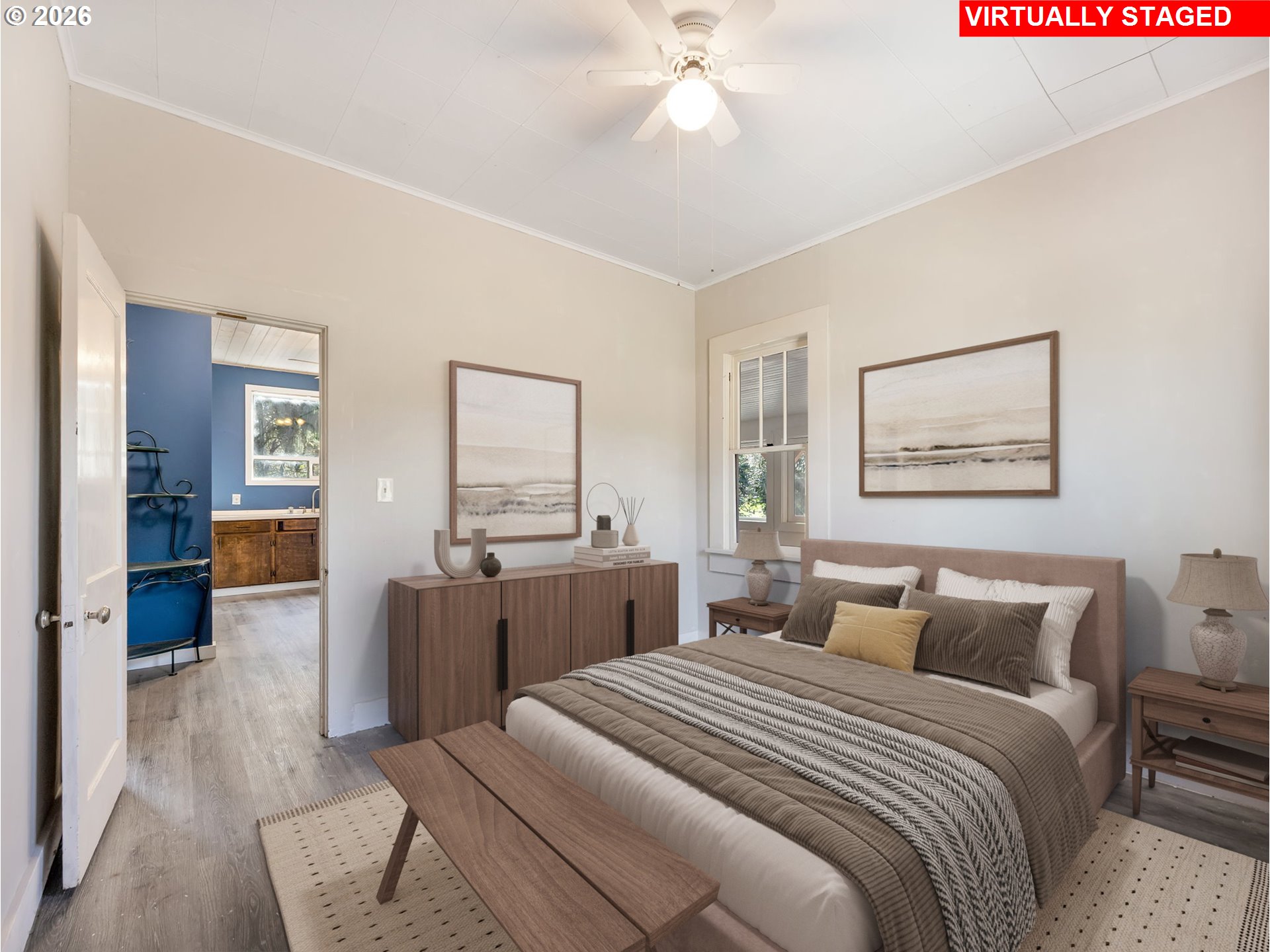 36290 7th Street Nehalem, OR 97131 - Photo 17 of 38 a bedroom with a large bed and a chandelier
