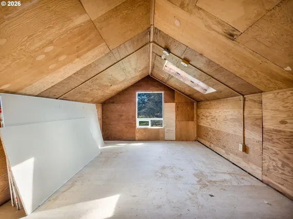 a view of a big room with windows