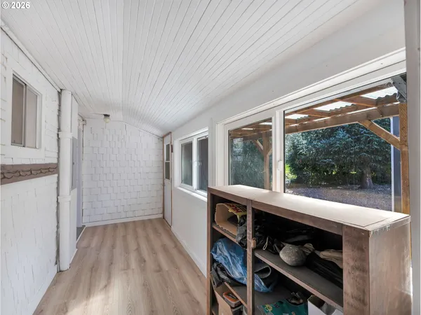 a room with wooden floor and furniture