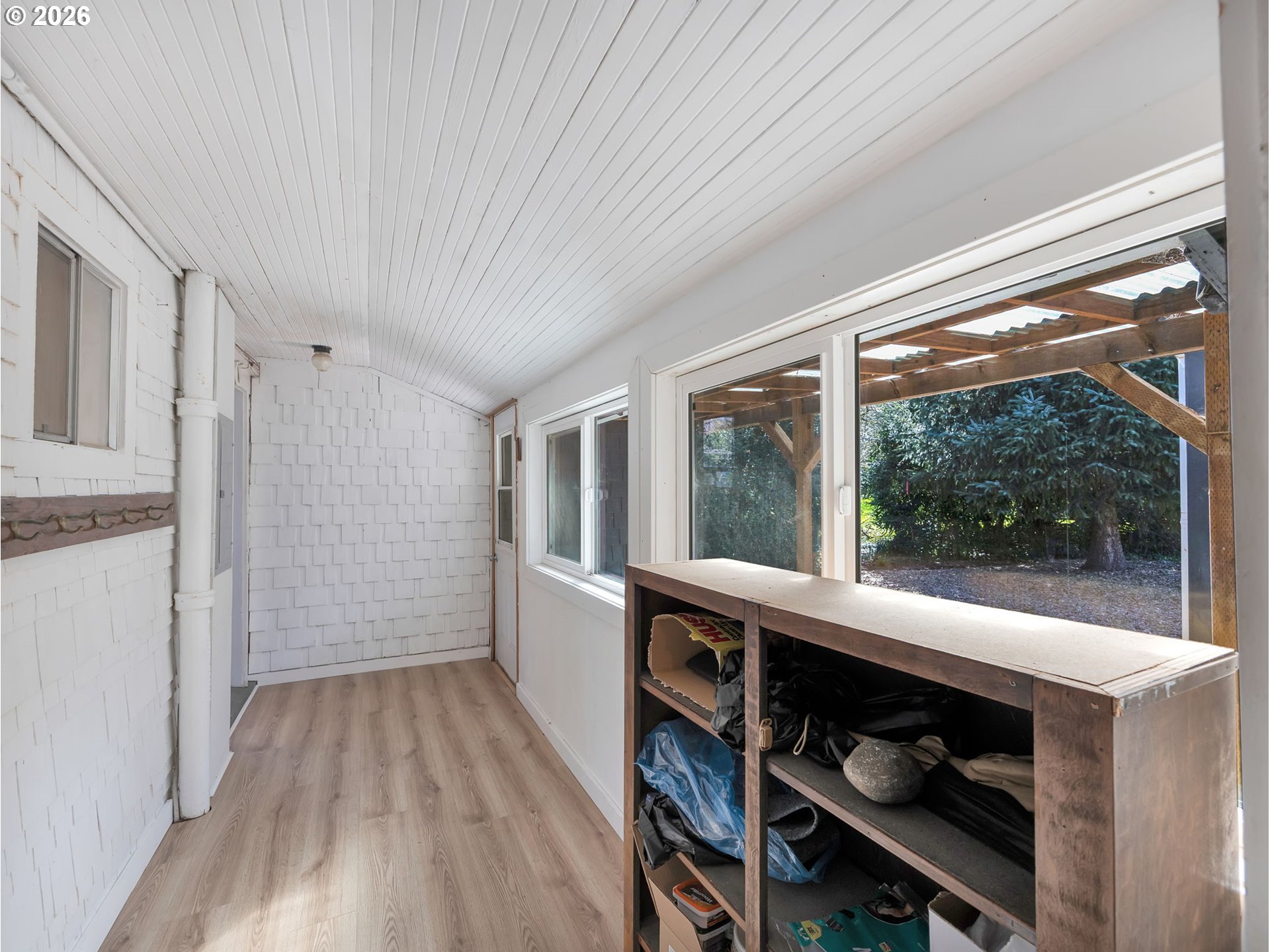 36290 7th Street Nehalem, OR 97131 - Photo 28 of 38 a room with wooden floor and furniture
