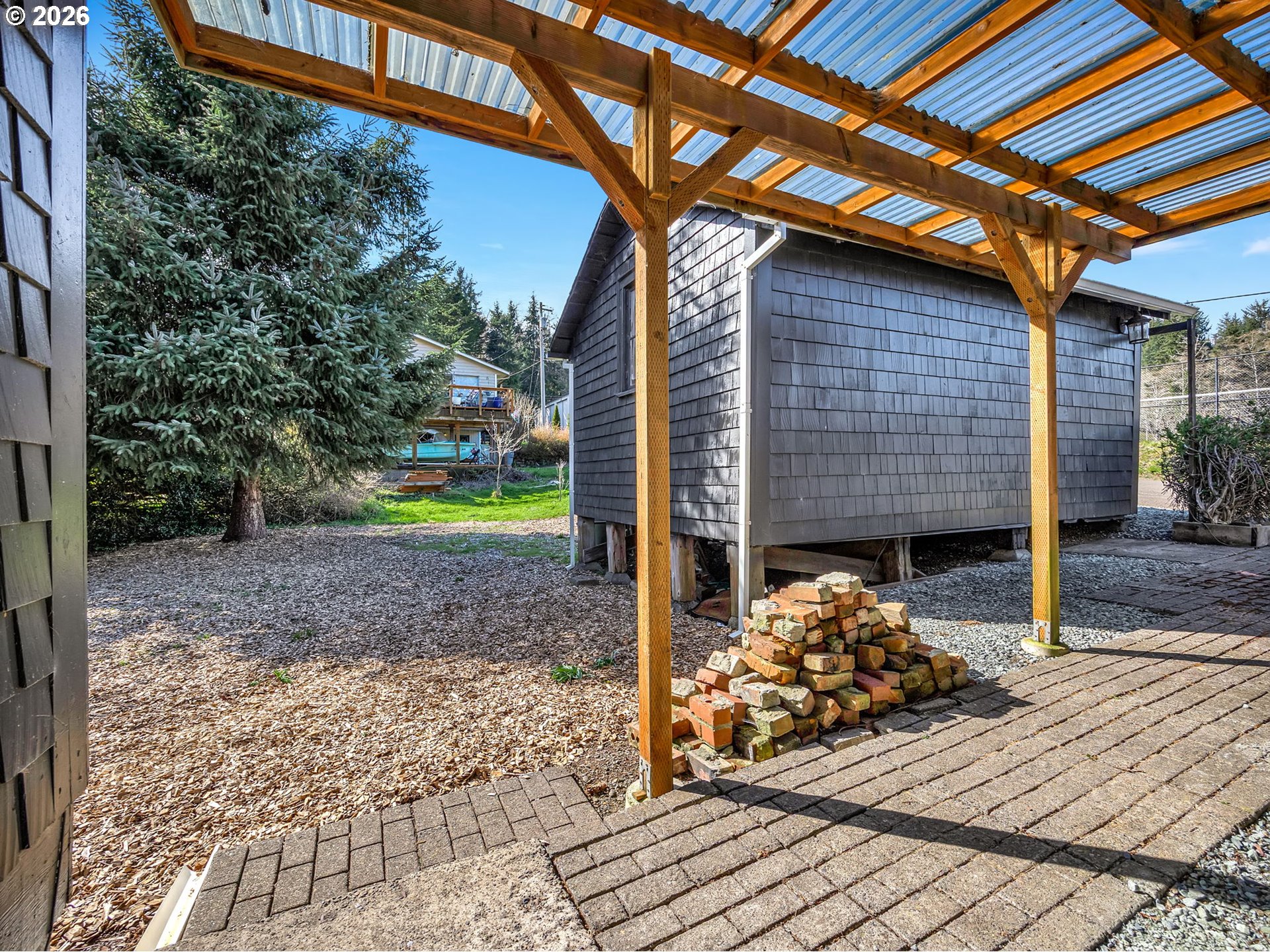 36290 7th Street Nehalem, OR 97131 - Photo 31 of 38 a front view of a house with garden