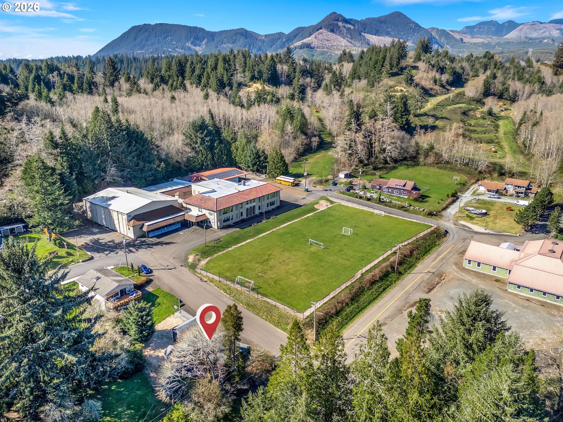 36290 7th Street Nehalem, OR 97131 - Photo 36 of 38 a view of a backyard with a table and chairs