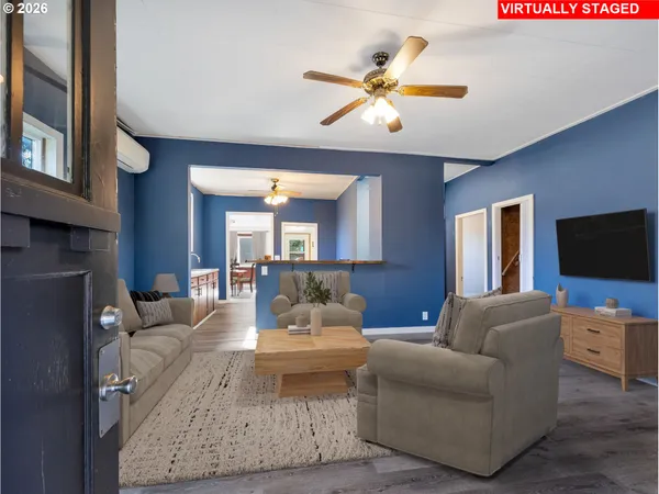 a living room with furniture and a flat screen tv