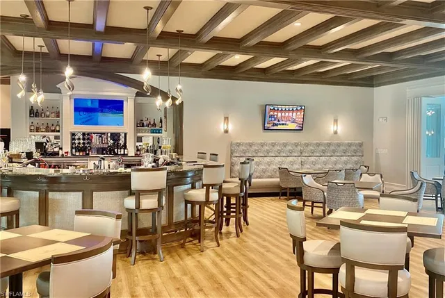 a group of people sitting at tables in a room