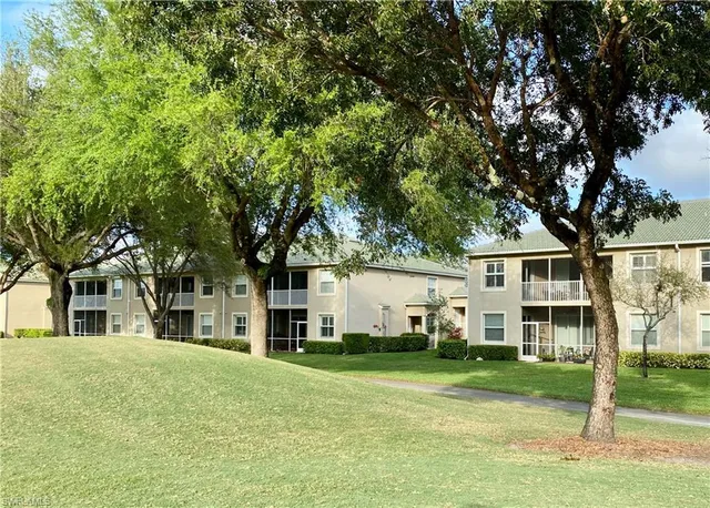 a view of a yard in front view of a house