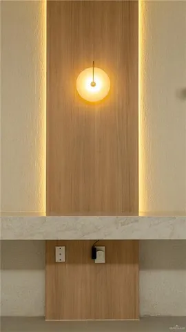 a view of an empty room with window and cabinet