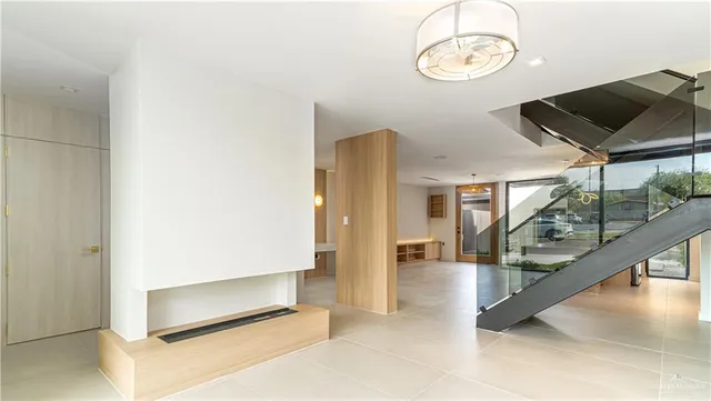 a bathroom with a shower sink and mirror
