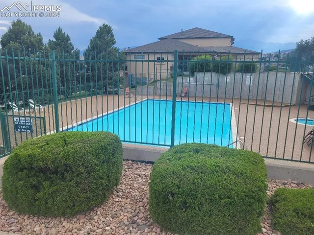 a view of a backyard with a small garden