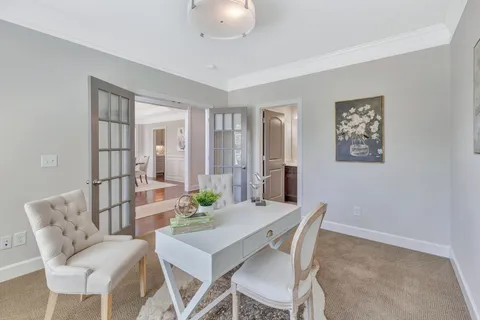 a living room with fireplace furniture and a wooden floor
