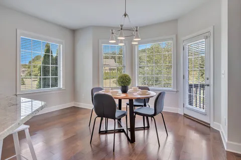 a kitchen with stainless steel appliances granite countertop a sink and cabinets