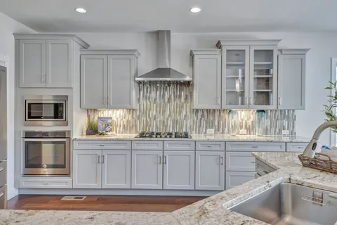 a kitchen with counter top space and sink