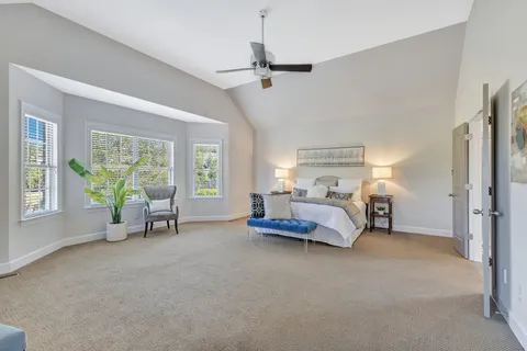a large bathroom with a glass door shower and sink