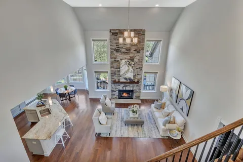 an empty room with a empty space and windows