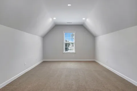 a view of an empty room and closet area