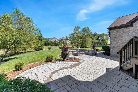 an aerial view of a house with outdoor space