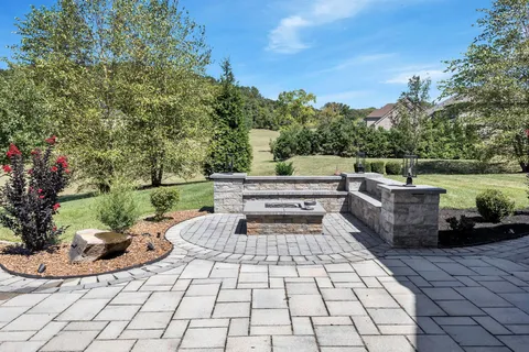 a view of a house with backyard porch and sitting area