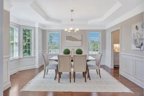 a dining room with furniture and window