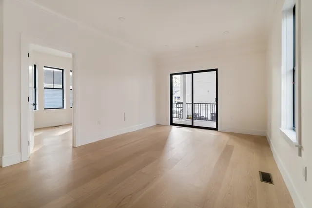 a view of an empty room with windows