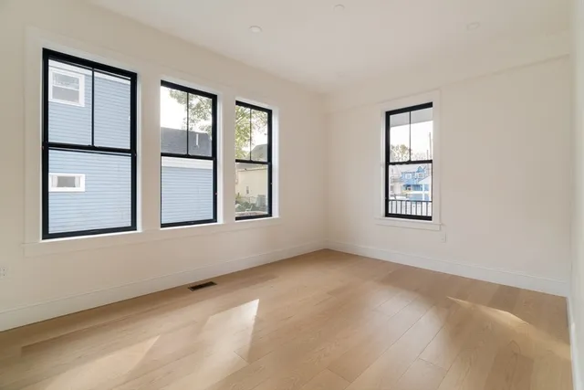 a bedroom with bed and a window