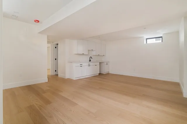 a bedroom with a bed and a flat screen television