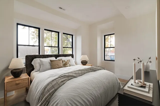 a view of balcony with couch and chairs