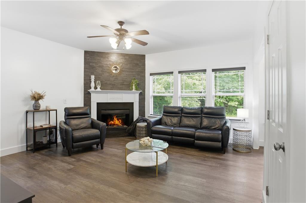 73 Allen Bridge Road Talmo, GA 30575 - Photo 17 of 33 a living room with furniture and a fireplace