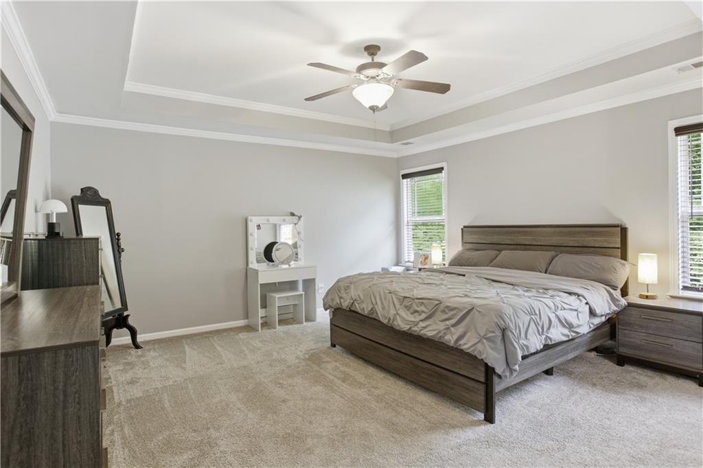 73 Allen Bridge Road Talmo, GA 30575 - Photo 20 of 33 a bedroom with a bed and a chandelier