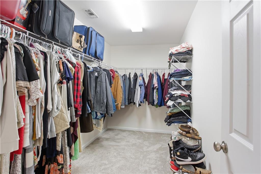 73 Allen Bridge Road Talmo, GA 30575 - Photo 25 of 33 a view of walk in closet with clothes and shoes