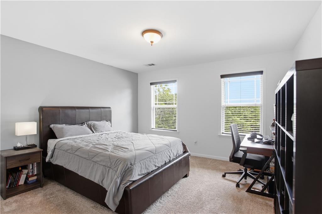 73 Allen Bridge Road Talmo, GA 30575 - Photo 27 of 33 a bedroom with a bed tv and a window