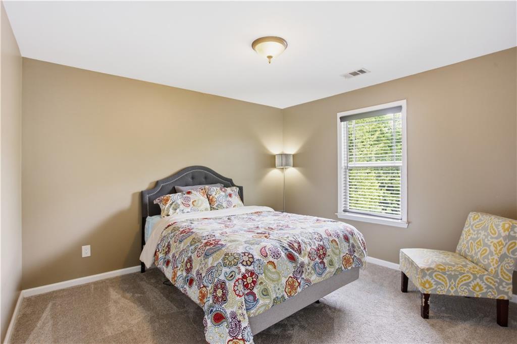 73 Allen Bridge Road Talmo, GA 30575 - Photo 30 of 33 a bedroom with a bed and window