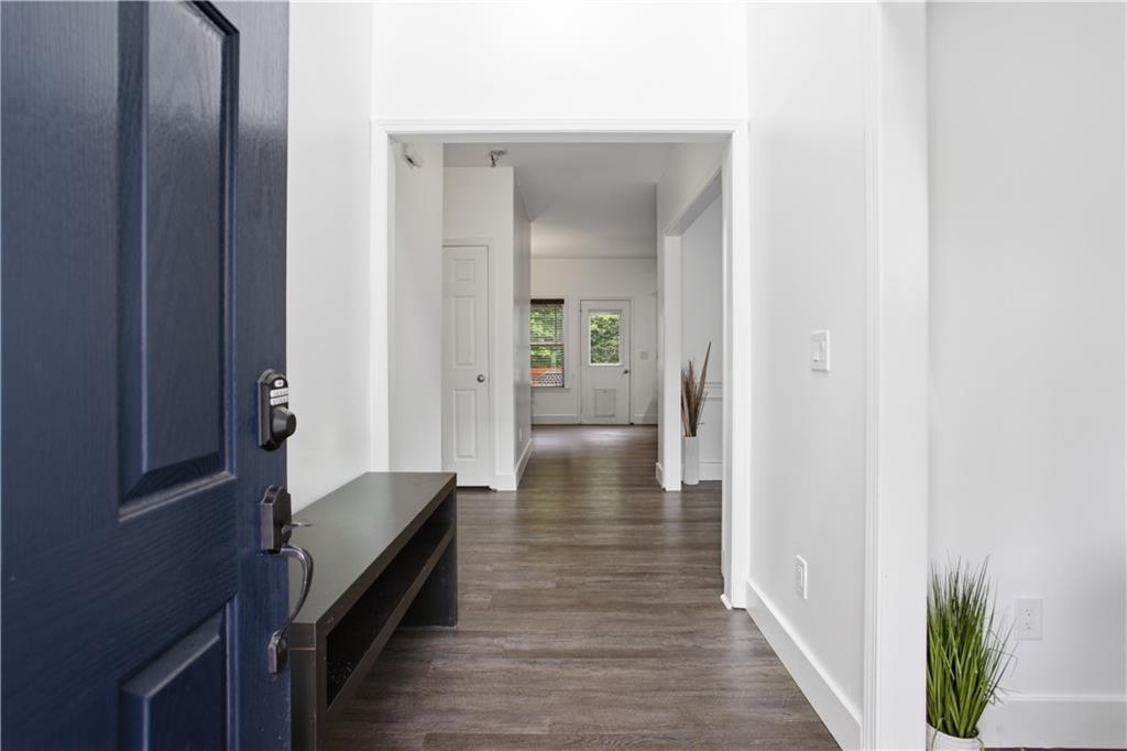 73 Allen Bridge Road Talmo, GA 30575 - Photo 3 of 33 a view of a hallway with wooden floor and staircase