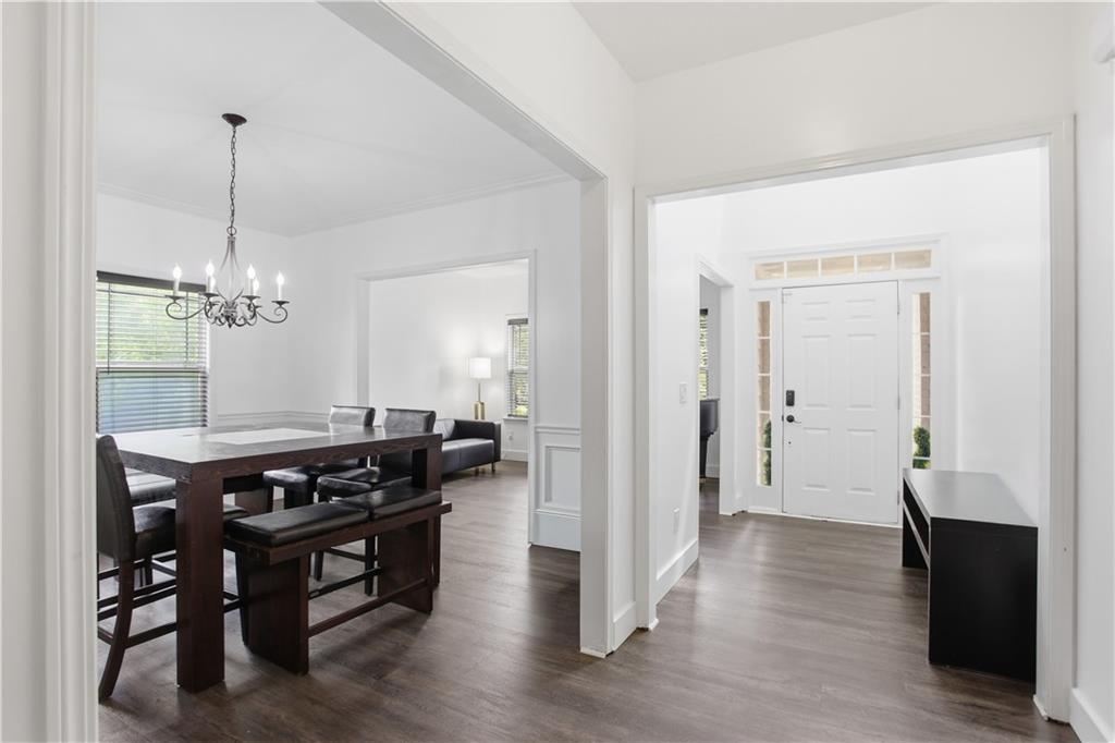 73 Allen Bridge Road Talmo, GA 30575 - Photo 4 of 33 a view of a dining room with furniture wooden floor and chandelier
