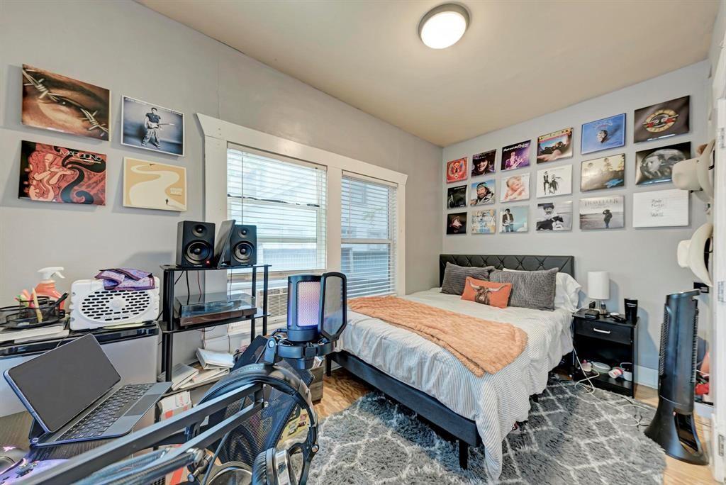 2834 Salado Street Austin, TX 78705 - Photo 15 of 40 a bedroom with a bed and a window