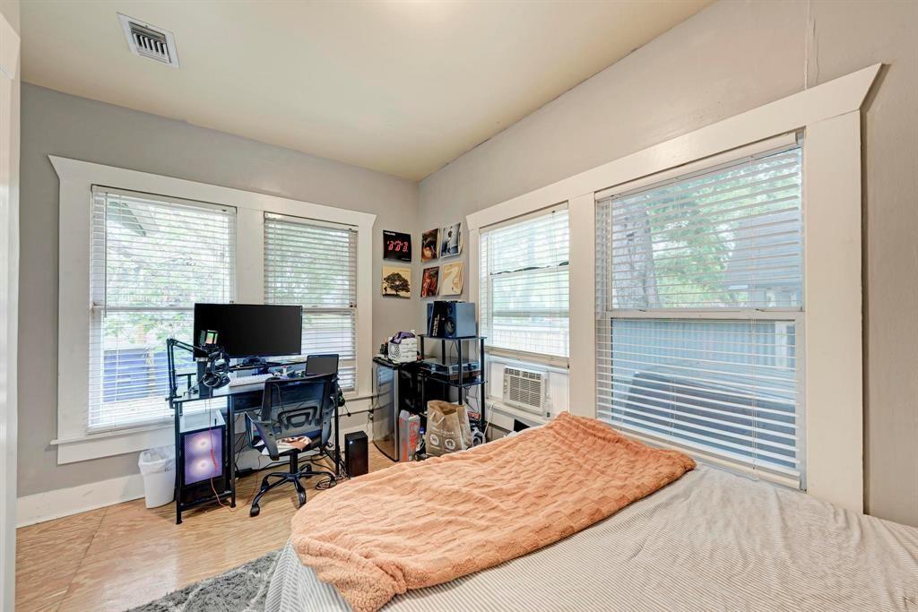 2834 Salado Street Austin, TX 78705 - Photo 16 of 40 a bedroom with a workspace