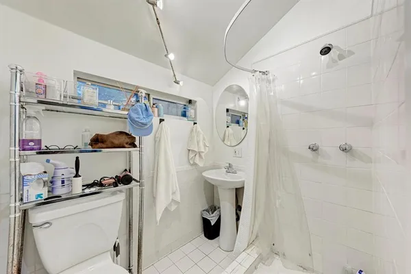 a kitchen with a refrigerator and cabinets