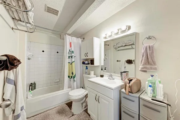 a bedroom with furniture and wooden floor