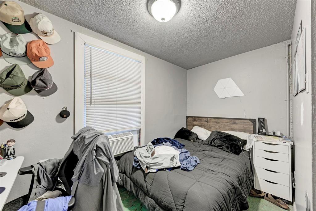 2834 Salado Street Austin, TX 78705 - Photo 29 of 40 a bedroom with a bed and cabinets