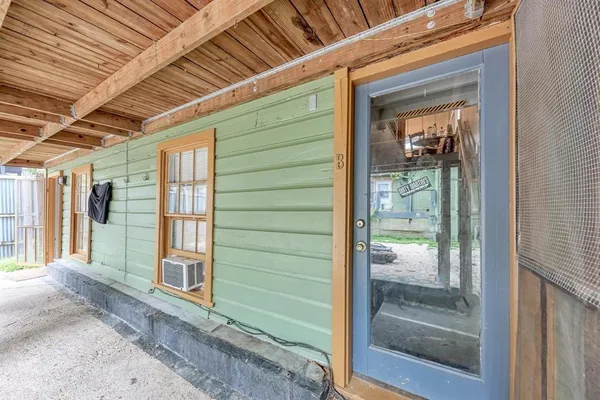 a kitchen with refrigerator cabinets and wooden floor