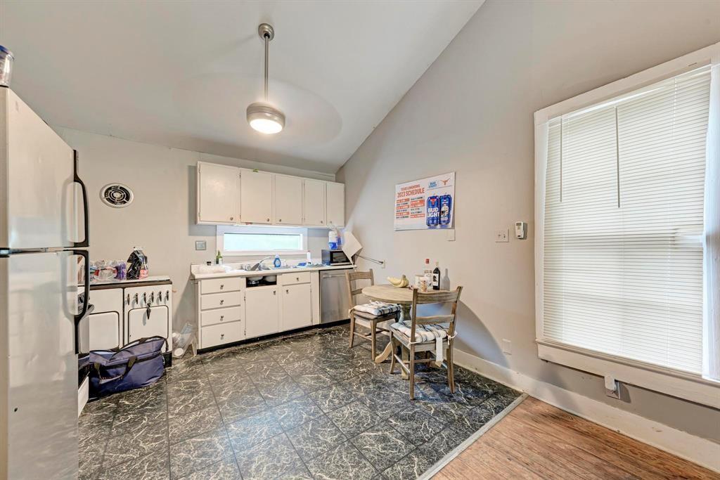 2834 Salado Street Austin, TX 78705 - Photo 33 of 40 a room with furniture a rug and white walls