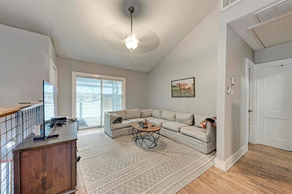 2834 Salado Street Austin, TX 78705 - Photo 34 of 40 a living room with furniture window and wooden floor