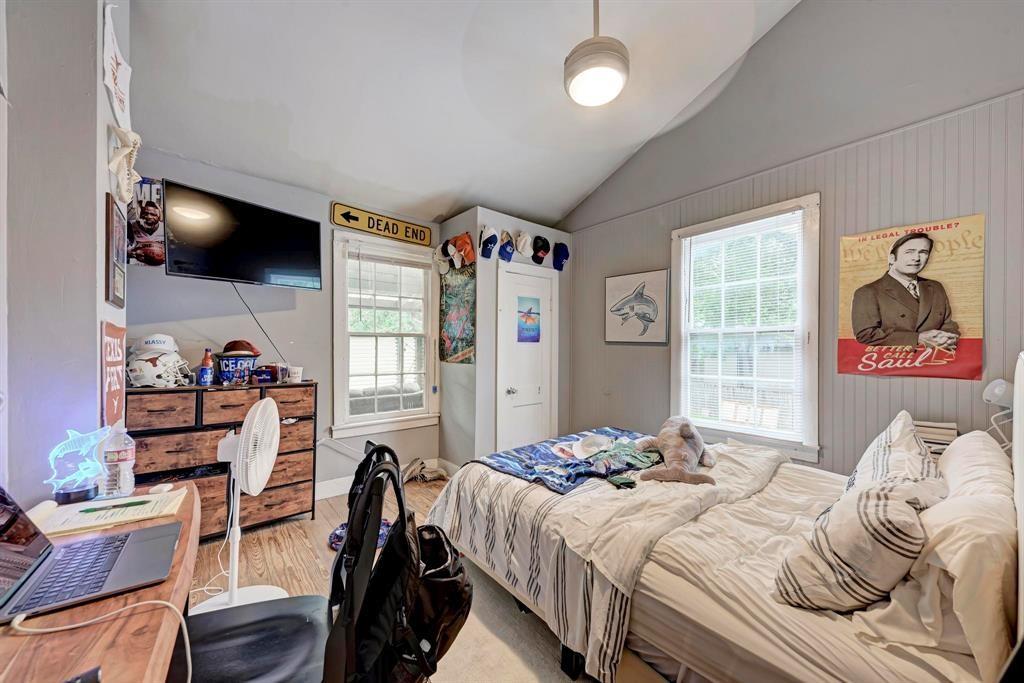 2834 Salado Street Austin, TX 78705 - Photo 37 of 40 a bedroom with a bed and a flat screen tv